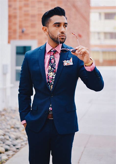 pink shirt with navy suit.